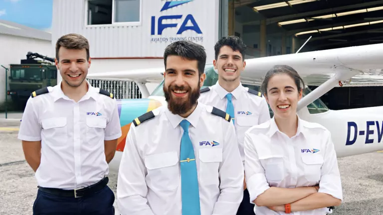 happy graduates in front of IFA hangar - ATPL(A) Course 100% All Included